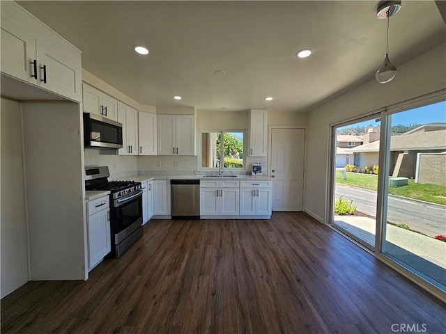 44516 La Paz Rd, Temecula, CA 92592 - kitchen with appliances with stainless steel finishes, dark wood finished floors, white cabinets, light countertops, and recessed lighting