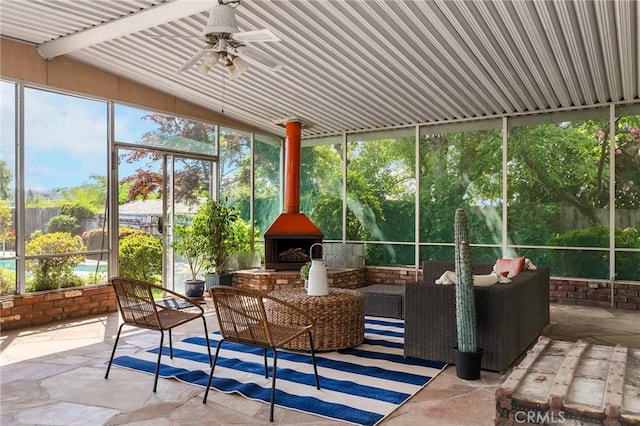 1539 Hammon Ave, Oroville, CA 95966 - sunroom / solarium featuring vaulted ceiling, an outdoor living space with a fireplace, ceiling fan, and healthy amount of natural light