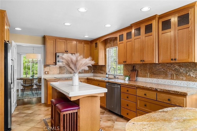 1539 Hammon Ave, Oroville, CA 95966 - kitchen with appliances with stainless steel finishes, a sink, healthy amount of natural light, recessed lighting, and a breakfast bar