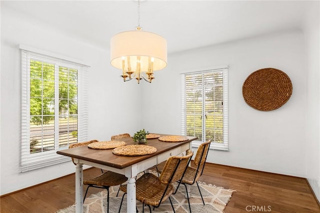 1539 Hammon Ave, Oroville, CA 95966 - dining room with wood finished floors and a chandelier