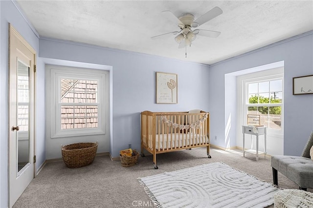 1539 Hammon Ave, Oroville, CA 95966 - bedroom featuring carpet, ornamental molding, baseboards, a crib, and ceiling fan