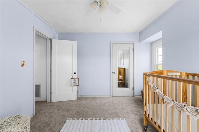 1539 Hammon Ave, Oroville, CA 95966 - carpeted bedroom with ornamental molding, a nursery area, a ceiling fan, and baseboards