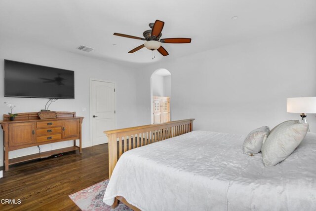 171 N Sunset Pl, Monrovia, CA 91016 - bedroom with dark wood-type flooring, arched walkways, and a ceiling fan