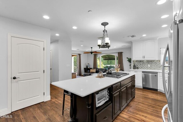 171 N Sunset Pl, Monrovia, CA 91016 - kitchen featuring stainless steel appliances, white cabinetry, light countertops, a chandelier, and recessed lighting