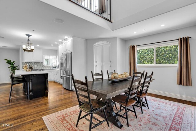 171 N Sunset Pl, Monrovia, CA 91016 - dining space with plenty of natural light, a chandelier, recessed lighting, arched walkways, and dark wood finished floors