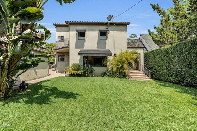 171 N Sunset Pl, Monrovia, CA 91016 - back of property with a balcony, stucco siding, and a yard