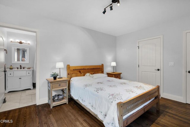 171 N Sunset Pl, Monrovia, CA 91016 - bedroom with wood finished floors and connected bathroom