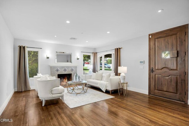 171 N Sunset Pl, Monrovia, CA 91016 - living area with plenty of natural light, wood finished floors, a tile fireplace, and recessed lighting
