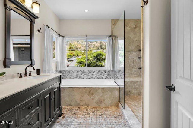 171 N Sunset Pl, Monrovia, CA 91016 - bathroom featuring a garden tub, vanity, and a tile shower
