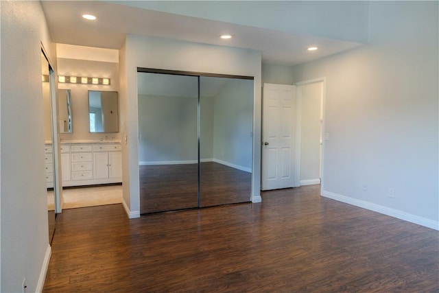 411 San Nicholas Ct, Laguna Beach, CA 92651 - unfurnished bedroom with dark wood-style flooring, baseboards, a closet, recessed lighting, and connected bathroom