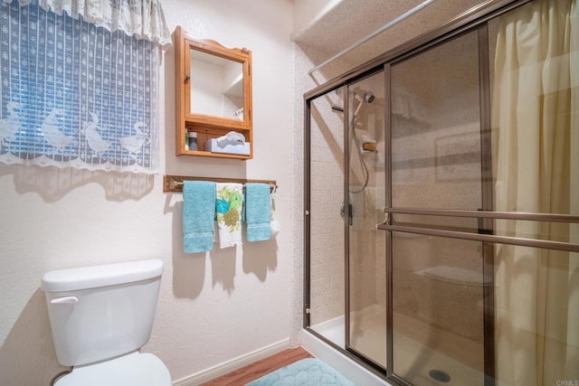 8516 Valley View Trl, Pine Valley, CA 91962 - full bathroom with toilet, a stall shower, wood finished floors, and baseboards