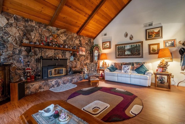 8516 Valley View Trl, Pine Valley, CA 91962 - living area featuring wooden ceiling with exposed beams, wood finished floors, high vaulted ceiling, and a stone fireplace