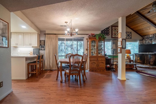 8516 Valley View Trl, Pine Valley, CA 91962 - dining space featuring wood finished floors, a chandelier, a textured ceiling, baseboards, and vaulted ceiling