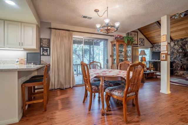 8516 Valley View Trl, Pine Valley, CA 91962 - dining area with vaulted ceiling, light wood finished floors, a chandelier, and a textured ceiling