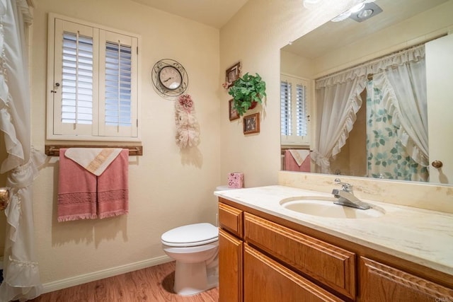 8516 Valley View Trl, Pine Valley, CA 91962 - full bathroom featuring wood finished floors, toilet, vanity, baseboards, and healthy amount of natural light