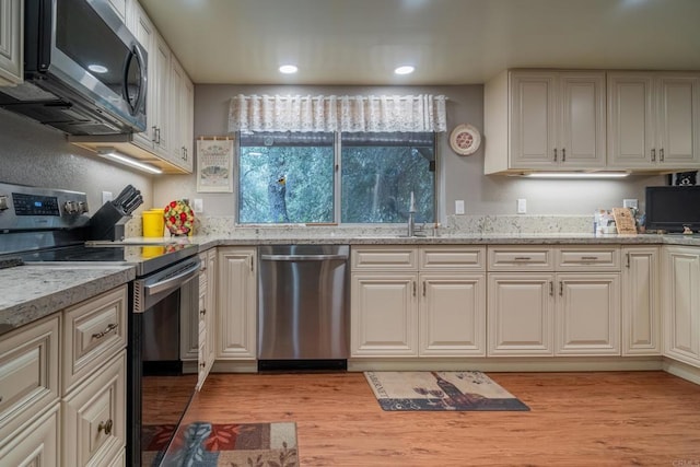 8516 Valley View Trl, Pine Valley, CA 91962 - kitchen featuring stainless steel appliances, light wood-type flooring, recessed lighting, and light stone counters