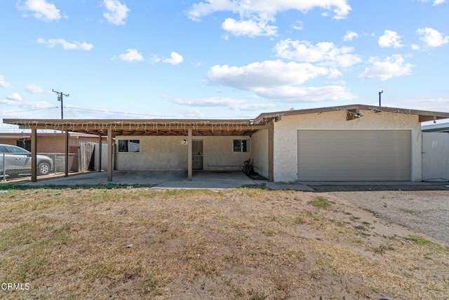374 Will Ave, Oxnard, CA 93036 - view of front facade with stucco siding, a garage, and driveway