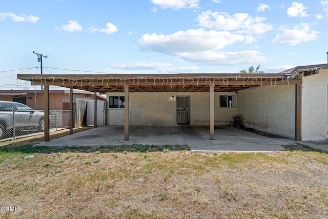 374 Will Ave, Oxnard, CA 93036 - back of house with stucco siding, a patio, and a carport