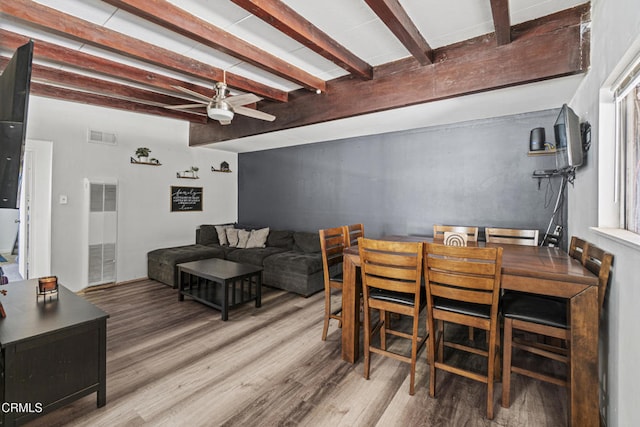 374 Will Ave, Oxnard, CA 93036 - dining room featuring a heating unit, a ceiling fan, wood finished floors, and beamed ceiling