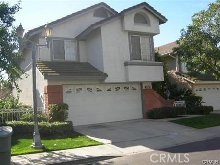 3249 Cambridge Dr, Chino Hills, CA 91709 - view of front of home with an attached garage and driveway