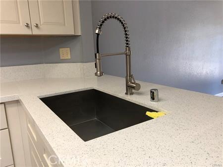 3249 Cambridge Dr, Chino Hills, CA 91709 - kitchen view of a sink and white cabinets