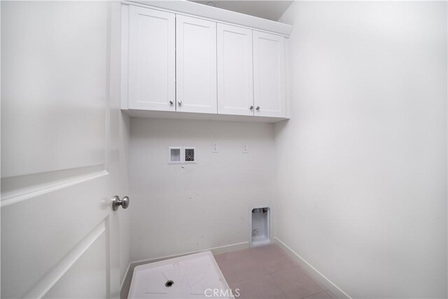 102 Anthology, Irvine, CA 92618 - washroom with cabinet space, hookup for a washing machine, hookup for an electric dryer, and baseboards