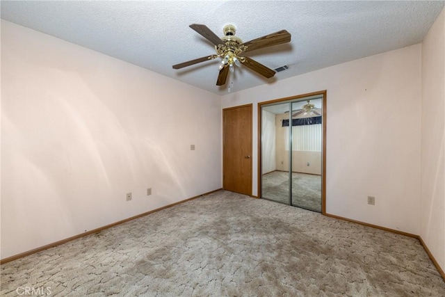 14153 Gayhead Rd, Apple Valley, CA 92307 - unfurnished bedroom featuring carpet flooring, baseboards, a ceiling fan, and a textured ceiling