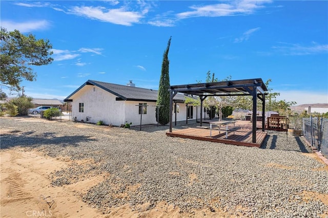 7495 Balsa Ave, Yucca Valley, CA 92284 - back of property featuring a pergola, a deck, and a fenced backyard