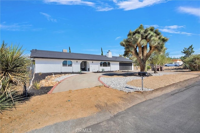 7495 Balsa Ave, Yucca Valley, CA 92284 - single story home with driveway and a garage