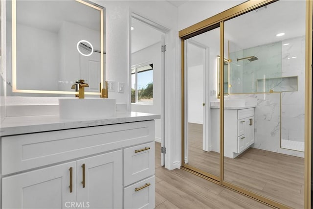 7495 Balsa Ave, Yucca Valley, CA 92284 - full bathroom featuring a marble finish shower, vanity, wood finished floors, and recessed lighting