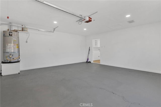 7495 Balsa Ave, Yucca Valley, CA 92284 - garage with strapped water heater, a garage door opener, and recessed lighting