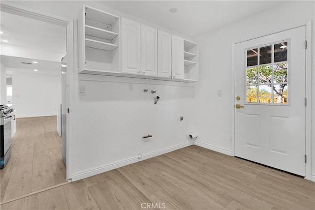 7495 Balsa Ave, Yucca Valley, CA 92284 - laundry area featuring cabinet space, hookup for a washing machine, light wood-style floors, hookup for an electric dryer, and recessed lighting