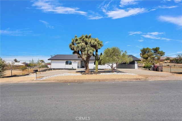7495 Balsa Ave, Yucca Valley, CA 92284 - view of front of home featuring driveway and a garage
