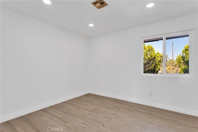 7495 Balsa Ave, Yucca Valley, CA 92284 - empty room with light wood-style flooring and recessed lighting