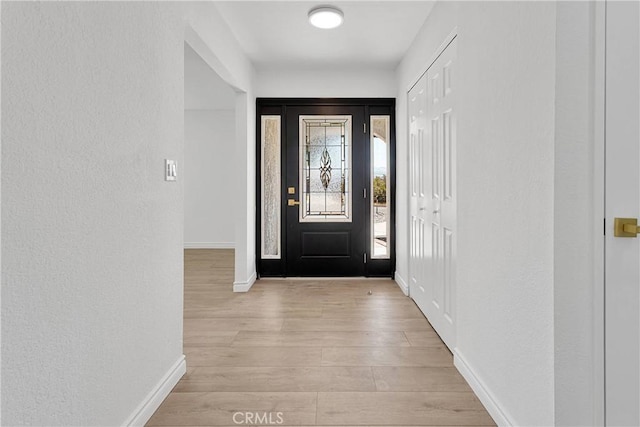 7495 Balsa Ave, Yucca Valley, CA 92284 - foyer with baseboards and light wood-type flooring