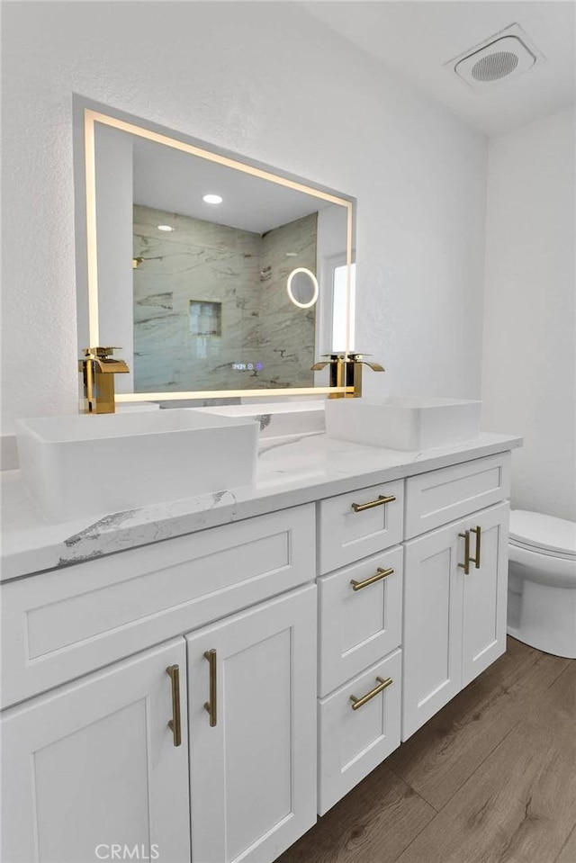 7495 Balsa Ave, Yucca Valley, CA 92284 - full bathroom featuring vanity, wood finished floors, and a marble finish shower