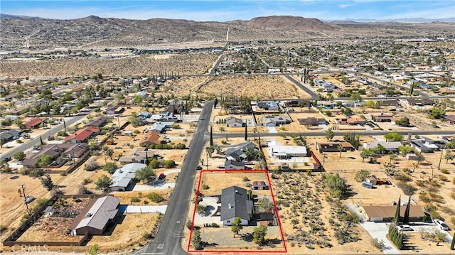 7495 Balsa Ave, Yucca Valley, CA 92284 - aerial view of residential area with mountains and property parcel outlined
