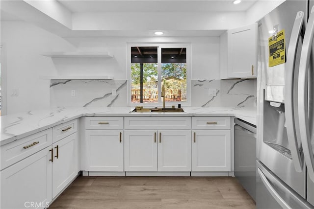 7495 Balsa Ave, Yucca Valley, CA 92284 - kitchen with appliances with stainless steel finishes, open shelves, white cabinets, tasteful backsplash, and light stone countertops