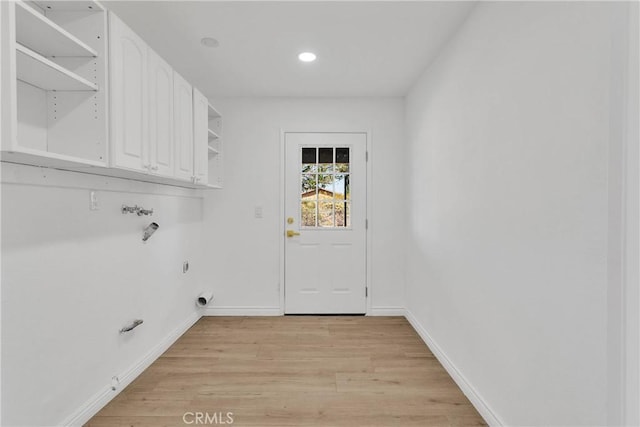 7495 Balsa Ave, Yucca Valley, CA 92284 - washroom with cabinet space, gas dryer hookup, washer hookup, light wood-type flooring, and recessed lighting