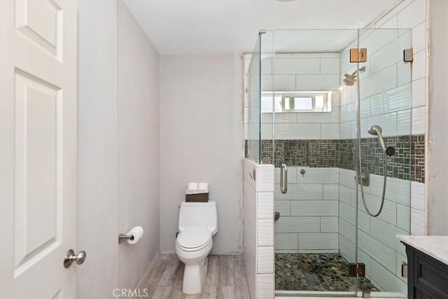 809 San Marino Ave, Montebello, CA 90640 - full bath featuring toilet, wood finished floors, a stall shower, and vanity