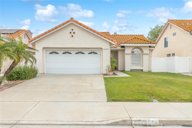 40280 Mimulus Way, Temecula, CA 92591 - mediterranean / spanish-style house featuring a tile roof, stucco siding, driveway, and a garage