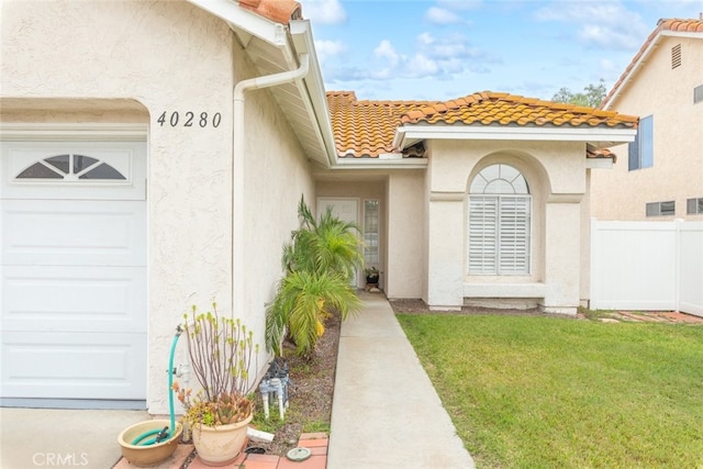 40280 Mimulus Way, Temecula, CA 92591 - entrance to property with stucco siding, a tile roof, and an attached garage