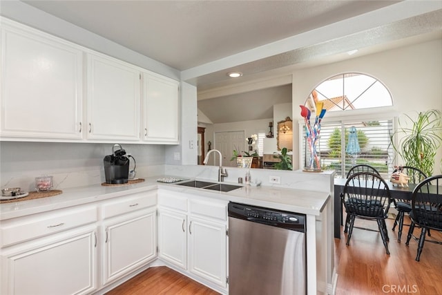 40280 Mimulus Way, Temecula, CA 92591 - kitchen with dishwasher, light countertops, light wood-style flooring, white cabinetry, and lofted ceiling