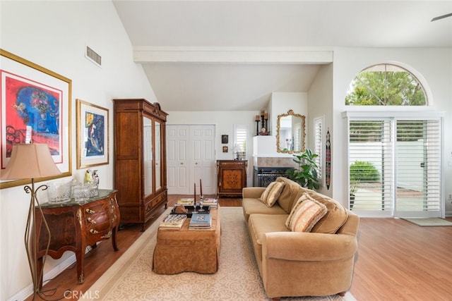 40280 Mimulus Way, Temecula, CA 92591 - living room featuring wood finished floors, high vaulted ceiling, and beam ceiling