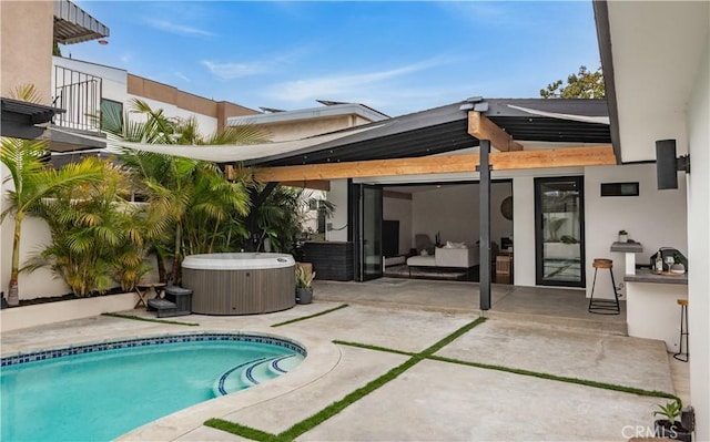 377 Flint Ave, Long Beach, CA 90814 - back of house featuring a hot tub, a balcony, a patio area, and an outdoor pool