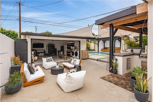 377 Flint Ave, Long Beach, CA 90814 - view of patio / terrace with washing machine and dryer, an outdoor pool, outdoor lounge area, a gazebo, and an outdoor structure