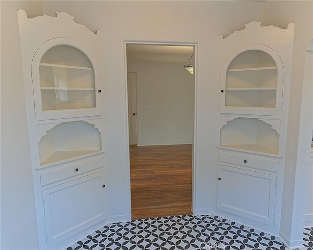 550 N 1st Ave, Upland, CA 91786 - hall with built in shelves, baseboards, and wood finished floors