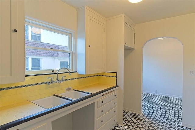 550 N 1st Ave, Upland, CA 91786 - kitchen featuring white cabinetry, tile countertops, and tasteful backsplash