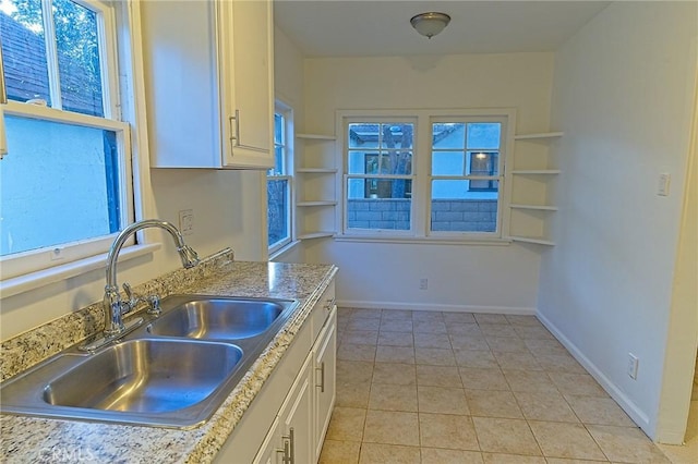 550 N 1st Ave, Upland, CA 91786 - kitchen featuring a sink, white cabinets, light tile patterned floors, light countertops, and baseboards