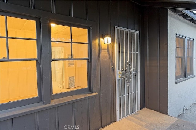 550 N 1st Ave, Upland, CA 91786 - doorway to property with board and batten siding